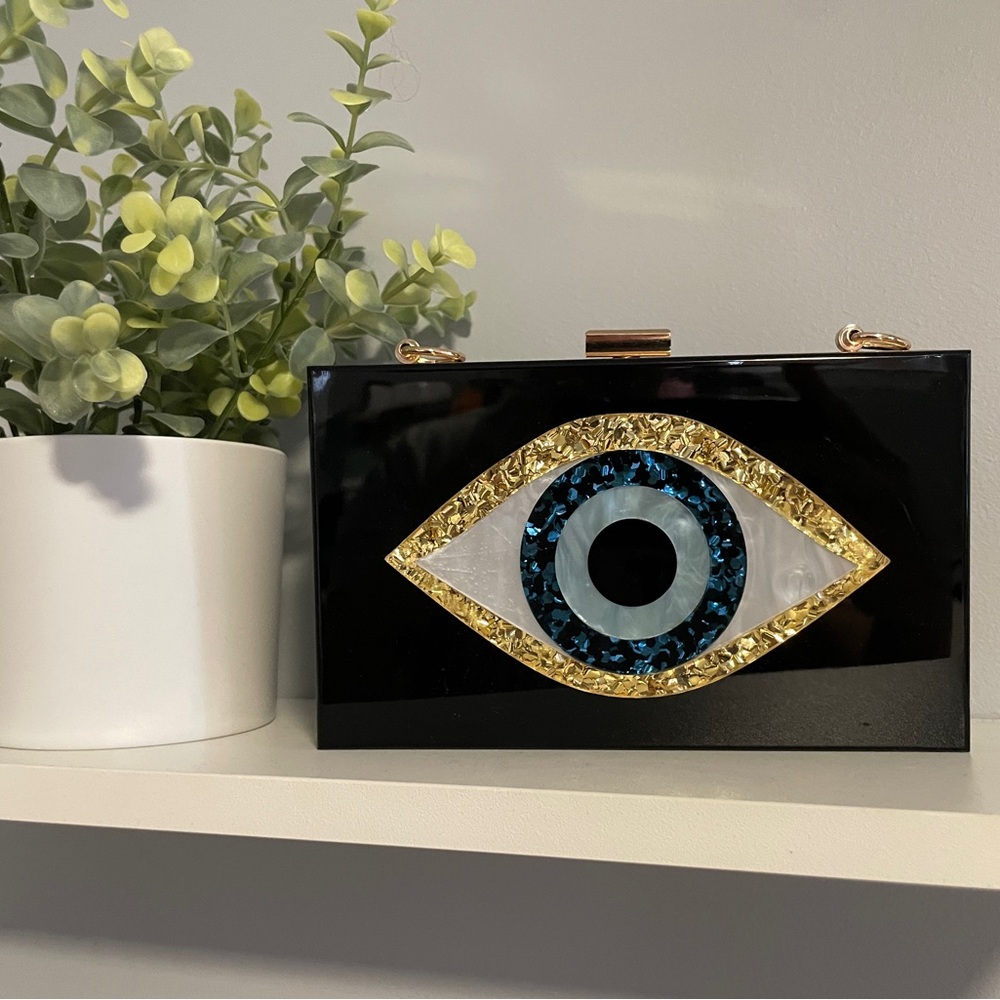 Chic Black Clutch with Gold and Blue Eye Design